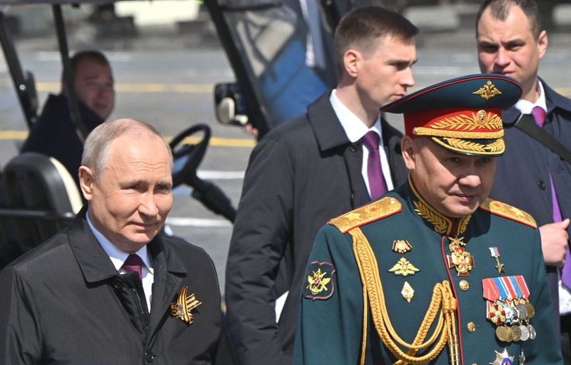 8428518 09.05.2023 Russian President Vladimir Putin and Defence Minister Sergei Shoigu walk after a Victory Day military parade, which marks the 78th anniversary of the victory over Nazi Germany in World War Two, in Red Square in Moscow, Russia. Evgeny Biyatov / Sputnik