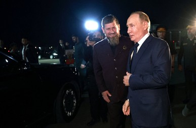 In this pool photograph distributed by Russian state owned Sputnik agency President Vladimir Putin (R) is greeted by the head of the Chechen Republic Ramzan Kadyrov (C) on arrival at Grozny airport, on August 20, 2024.,Image: 900192508, License: Rights-managed, Restrictions: Editor's note : this image is distributed by Russian state owned agency Sputnik, Model Release: no