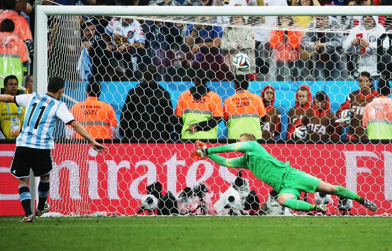 epa04308889 Argentina's Maxi Rodriguez (L) scores the winning penalty during the penalty shoot-out against goalkeeper Jasper Cillessen of the Netherlands during the FIFA World Cup 2014 semi final match between the Netherlands and Argentina at the Arena Corinthians in Sao Paulo, Brazil, 09 July 2014. (RESTRICTIONS APPLY: Editorial Use Only, not used in association with any commercial entity - Images must not be used in any form of alert service or push service of any kind including via mobile alert services, downloads to mobile devices or MMS messaging - Images must appear as still images and must not emulate match action video footage - No alteration is made to, and no text or image is superimposed over, any published image which: (a) intentionally obscures or removes a sponsor identification image; or (b) adds or overlays the commercial identification of any third party which is not officially associated with the FIFA World Cup) EPA/DIEGO AZUBEL EDITORIAL USE ONLY