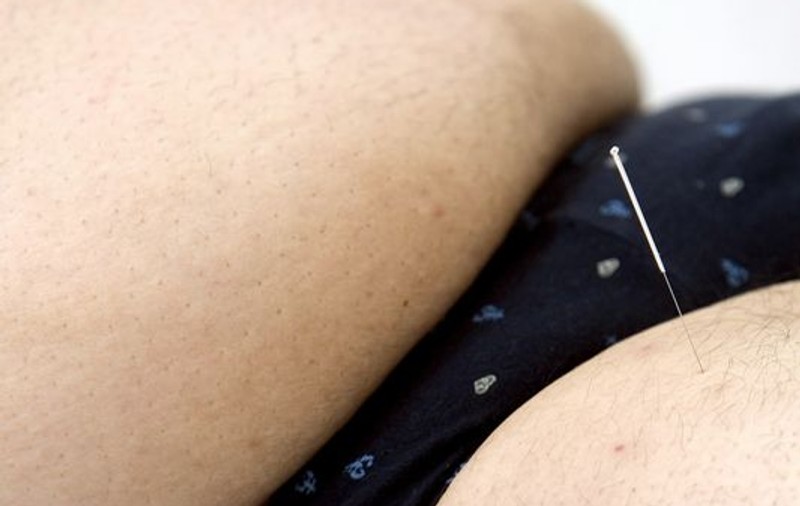 Un deţinut obez a ascuns un pistol sub straturile de grăsime