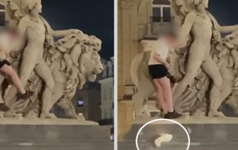Momentul în care statuia din fața Bursei din Bruxelles este distrusă de un turist beat care se cațără pe ea