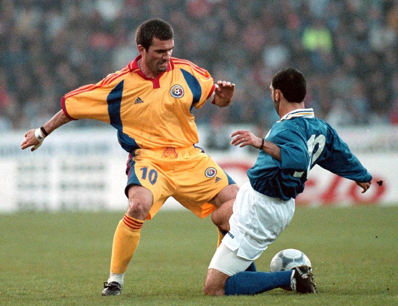 CON01-20000426-CONSTANTA, ROMANIA: Romanian playmaker Gheorghe Hagi (left) fights for the ball with Cyprus' stopper Aristocleous Aristor (R) during the first half of the friendly soccer match between Romania and Cyprus at the "Gheorghe Hagi stadium" in Constanta, some 250km south-east from Bucharest. EPA PHOTO EPA/ROBERT GHEMENT