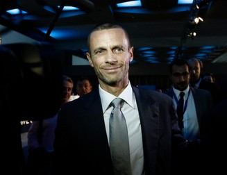 epa05538914 President of the Football Association of Slovenia Aleksander Ceferin (C) reacts after he was elected as the new UEFA President at 12th Extraordinary UEFA Congress in Athens, Greece, 14 September 2016. Michel Platini has been given permission by Fifa's ethics committee to address the Uefa congress in Athens despite his four-year ban from all football-related activity. EPA/YANNIS KOLESIDIS