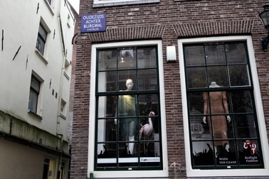 TO GO WITH AFP STORY BY JAN HENNOP A view of windows where 'Redlight Fashion' have replaced windows with prostitutes in the wallen of Amsterdam on November 15, 2012, the Netherlands. Twins Martine and Louise Fokkens, nicknamed the 'Queens of the wallen', are Amsterdam's oldest prostitutes, having worked for fifty years in the city's red-light-district, and they have wrote two books about their experiences.,Image: 147295988, License: Rights-managed, Restrictions: TO GO WITH AFP STORY BY JAN HENNOP, Model Release: no