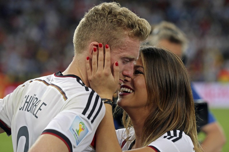 epa04315142 Montana Yorke (R), girlfriend of German player Andre Schuerrle (L) congratulates him after winning the FIFA World Cup 2014 final between Germany and Argentina at the Estadio do Maracana in Rio de Janeiro, Brazil, 13 July 2014. (RESTRICTIONS APPLY: Editorial Use Only, not used in association with any commercial entity - Images must not be used in any form of alert service or push service of any kind including via mobile alert services, downloads to mobile devices or MMS messaging - Images must appear as still images and must not emulate match action video footage - No alteration is made to, and no text or image is superimposed over, any published image which: (a) intentionally obscures or removes a sponsor identification image; or (b) adds or overlays the commercial identification of any third party which is not officially associated with the FIFA World Cup) EPA/ANTONIO LACERDA EDITORIAL USE ONLY