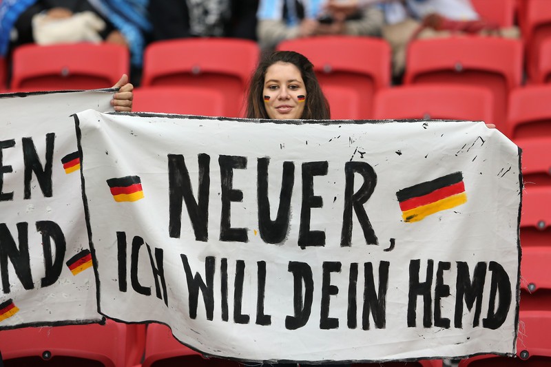 epa04292280 Germany supporter holds abanner reading 'Neuer I want your jersey' prior the FIFA World Cup 2014 round of 16 match between Germany and Algeria at the Estadio Beira-Rio in Porto Alegre, Brazil, 30 June 2014. (RESTRICTIONS APPLY: Editorial Use Only, not used in association with any commercial entity - Images must not be used in any form of alert service or push service of any kind including via mobile alert services, downloads to mobile devices or MMS messaging - Images must appear as still images and must not emulate match action video footage - No alteration is made to, and no text or image is superimposed over, any published image which: (a) intentionally obscures or removes a sponsor identification image; or (b) adds or overlays the commercial identification of any third party which is not officially associated with the FIFA World Cup) EPA/MOHAMED MESSARA EDITORIAL USE ONLY