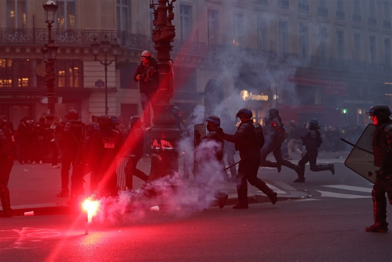 epa10539150 French anti-riot police in action ‘at ‘Place de l’Opera’ as thousands of people participate in a protest against the government's reform of the pension system in Paris, France, 23 March 2023. Protests continue in France after the prime minister announced on 16 March 2023 the use of Article 49 paragraph 3 (49.3) of the French Constitution to have the text on the controversial pension reform law - raising retirement age from 62 to 64 - be definitively adopted without a vote. EPA-EFE/MOHAMMED BADRA