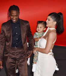 SANTA MONICA, CA - AUGUST 27: (L-R) Travis Scott, Stormi Webster and Kylie Jenner attend the Travis Scott: "Look Mom I Can Fly" Los Angeles Premiere at The Barker Hanger on August 27, 2019 in Santa Monica, California.