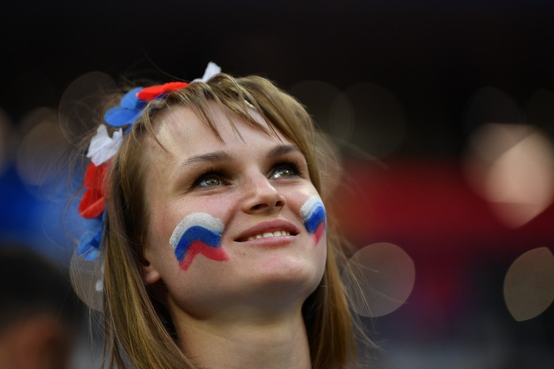 epa06807983 A supporter of Russia during the FIFA World Cup 2018 group A preliminary round soccer match between Russia and Saudi Arabia in Moscow, Russia, 14 June 2018. (RESTRICTIONS APPLY: Editorial Use Only, not used in association with any commercial entity - Images must not be used in any form of alert service or push service of any kind including via mobile alert services, downloads to mobile devices or MMS messaging - Images must appear as still images and must not emulate match action video footage - No alteration is made to, and no text or image is superimposed over, any published image which: (a) intentionally obscures or removes a sponsor identification image; or (b) adds or overlays the commercial identification of any third party which is not officially associated with the FIFA World Cup) EPA-EFE/PETER POWELL EDITORIAL USE ONLY