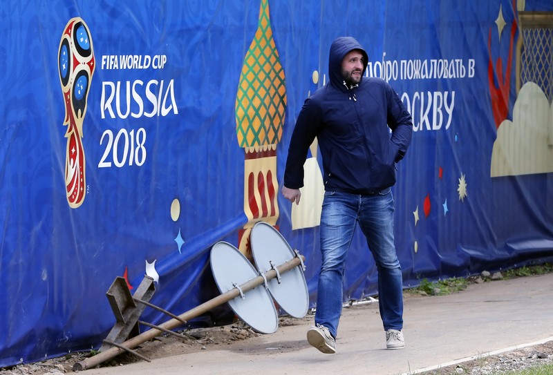 epa06788751 A man walks in front of the logo of the FIFA socceer World Cup 2018 in Moscow, Russia 06 June 2018. The FIFA World Cup 2018 will take place in Russia from 14 June until 15 July 2018. EPA-EFE/YURI KOCHETKOV