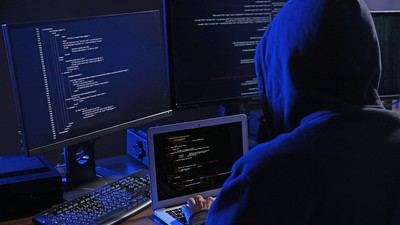 Hacker,With,Computers,In,Dark,Room.,Cyber,Crime