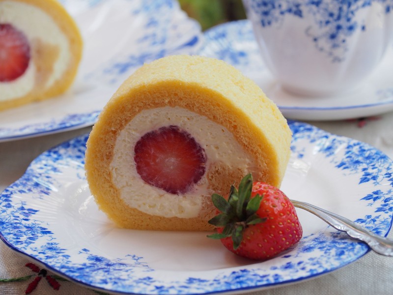 57267970 - strawberry roll cake on plate
