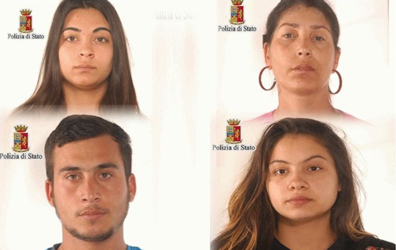 Români reținuți în Italia, după ce au fost prinși că au furat cu ajutorul unor haine groase