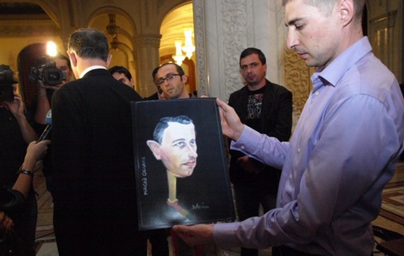 Foto | Pesediştii au simţul umorului. Au cumpărat la greu caricaturi cu liderii lor!