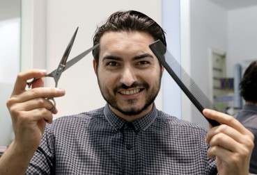 epa05401365 Spanish hairdresser Jorge De Sancho poses for photographers a day before departing to France to cut the hair of Iceland's national team players in Valencia, Spain, 01 July 2016. De Sancho was invited by Jean Pierre Landry, French hairdresser who also works in San Sebastian and is a friend of Icelandic striker Alfred Finnbogason. Iceland will face France in the EURO 2016 soccer tournament's quarter-final match on 03 July 2016. EPA/JUAN CARLOS CARDENAS