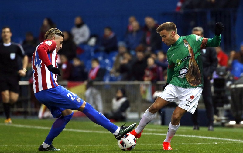 Atletico Madrid s-a calificat în optimile Cupei Spaniei în fața unei echipe din liga a treia, care a jucat cu jamonul pe tricouri