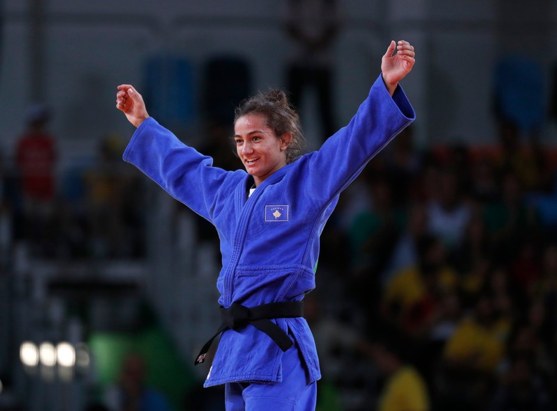 epa05462952 Majlinda Kelmendi of Kosovo celebrates after winning the gold in the women's 52kg bout against Odette Giuffrida of Italy in the Rio 2016 Olympic Games Judo events at the Carioca Arena 2 in the Olympic Park in Rio de Janeiro, Brazil, 07 August 2016. EPA/ORLANDO BARRIA