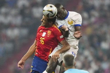 Spain's Rodri, left, and Randal Kolo Muani of France head the ball during a semifinal match between Spain and France at the Euro 2024 soccer tournament in Munich, Germany, Tuesday, July 9, 2024.,Image: 888551156, License: Rights-managed, Restrictions: This content is intended for editorial use only. For other uses, additional clearances may be required., Model Release: no