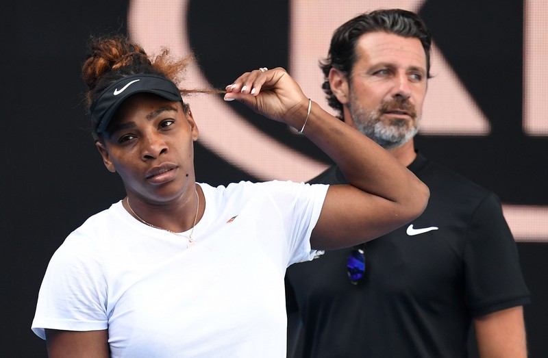 epa07276375 Serena Williams of the United States (L) gestures alongside her coach Patrick Mouratoglou (R) during a practice session for the Australian Open at the Margaret Court Arena in Melbourne, Australia, 12 January 2019. EPA-EFE/JULIAN SMITH AUSTRALIA AND NEW ZEALAND OUT