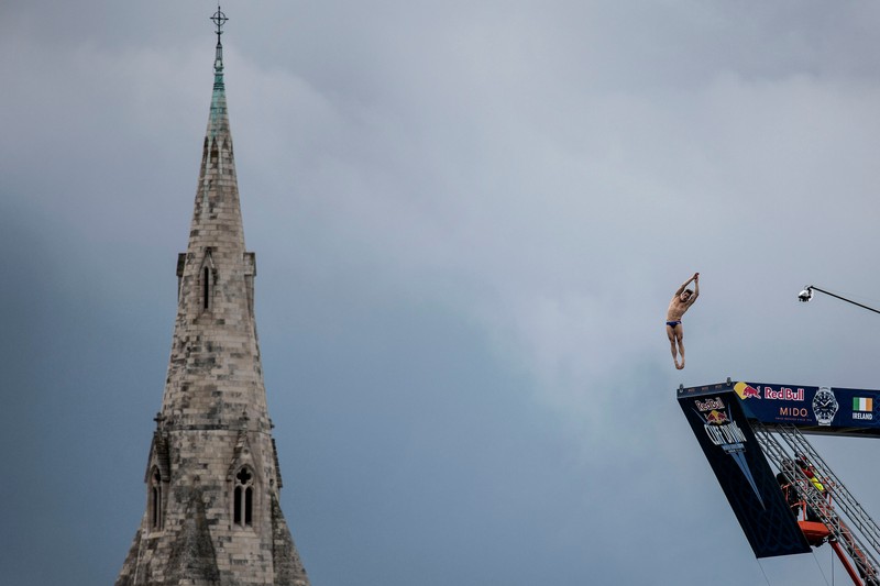 Constantin Popovici of Romania dives from the 27 metre platform at Dun Laoghaire Harbour during the first training session of the second stop of the Red Bull Cliff Diving World Series in Dublin, Ireland on May 10, 2019.