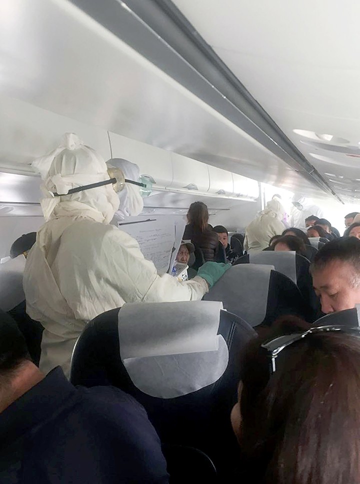 Dramatic pictures showed urgent checks by emergency staff in protective clothing on air passengers arriving in Mongolian capital  Ulaanbaatar on a flight from Bayan, Uglii and Khovd.