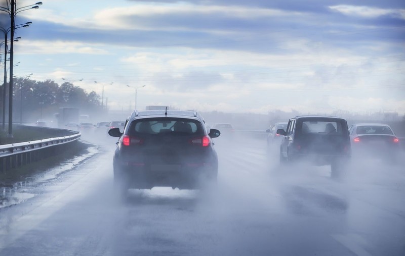 Driving on a wet highway in the rain