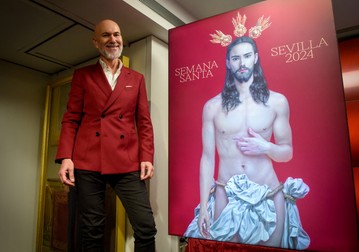 Spanish artist Salustiano Garcia stands next to the poster he created for the 'Semana Santa de Sevilla 2024' (Sevilla's Holy Week celebrations) during the poster's official presentation in Sevilla on January 27, 2024. The official poster chosen for the Holy Week festivities in Seville (south) arouses the anger of ultra-conservatives, who demand its withdrawal, deeming it "offensive" for Catholics.,Image: 841571456, License: Rights-managed, Restrictions: , Model Release: no