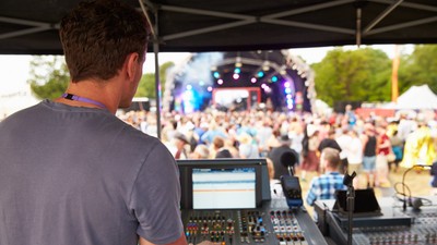 Sound,And,Lighting,Engineer,At,An,Outdoor,Festival,Concert