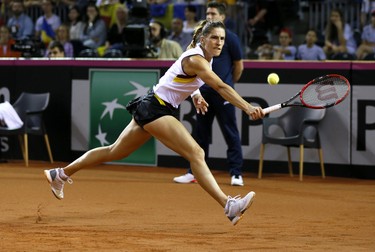 epa05263673 Andrea Petkovic of Germany in action against Romania's Monica Niculescu during the Fed Cup World Group play-off tie Romania vs Germany in Cluj city, 450Km north-west from Bucharest, Romania, 17 April 2016. EPA/ROBERT GHEMENT