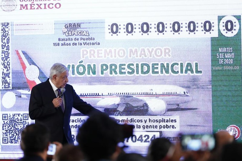epa08172923 The president of Mexico, Andres Manuel Lopez Obrador, speaks during his daily press conference at the National Palace in Mexico City, Mexico, 28 January 2020. Obrador who has not found a buyer for the 130 million US dollar presidential plane, a Boeing 787 acquired in 2015 by his predecessor, presented ticket designs for a potential raffle draw. The president said that next week he will resolve the issue as he will hold a meeting with cabinet participants on this issue. EPA-EFE/Jose Mendez