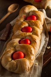 37472221 - homemade greek easter bread with red eggs