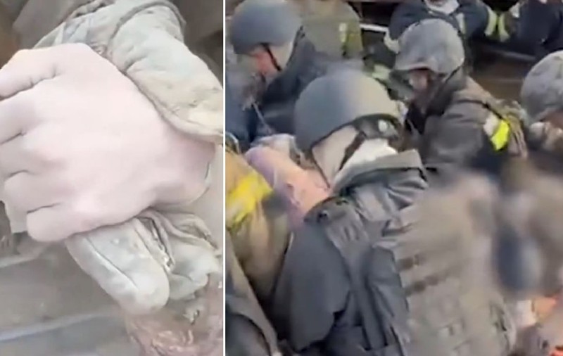 Momentul în care o femeie îngropată de vie sub dărâmături întinde mâna cerând ajutor, după un bombardament în Zaporojie