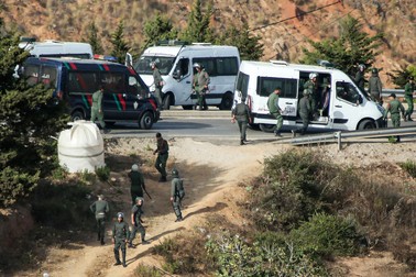Members of Morocco's Auxiliary Forces deploy to prevent illegal crossings of the land border fence with Spain's African enclave of Ceuta near Fnideq in northern Morocco on September 15, 2024.,Image: 907996574, License: Rights-managed, Restrictions: , Model Release: no