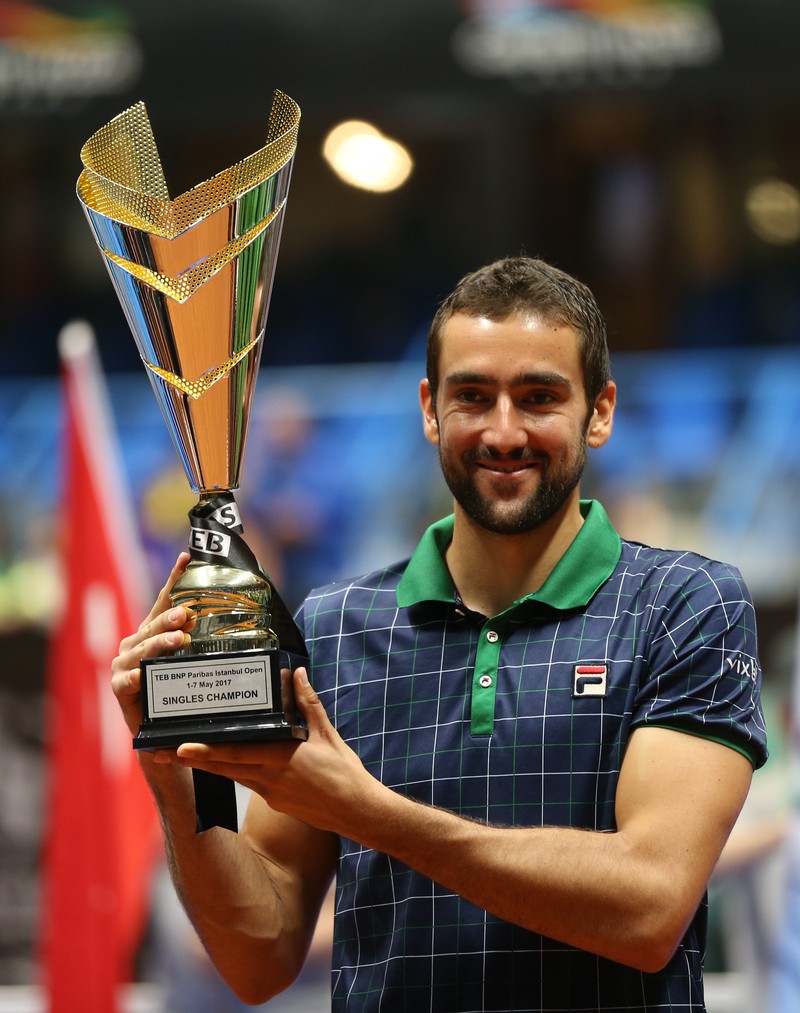epa05948814 Marin Cilic of Croatia holds his trophy after winning against Milos Raonic of Canada in the final match for the Istanbul Open tennis tournament, in Istanbul, Turkey, 07 May 2017. EPA/TOLGA BOZOGLU
