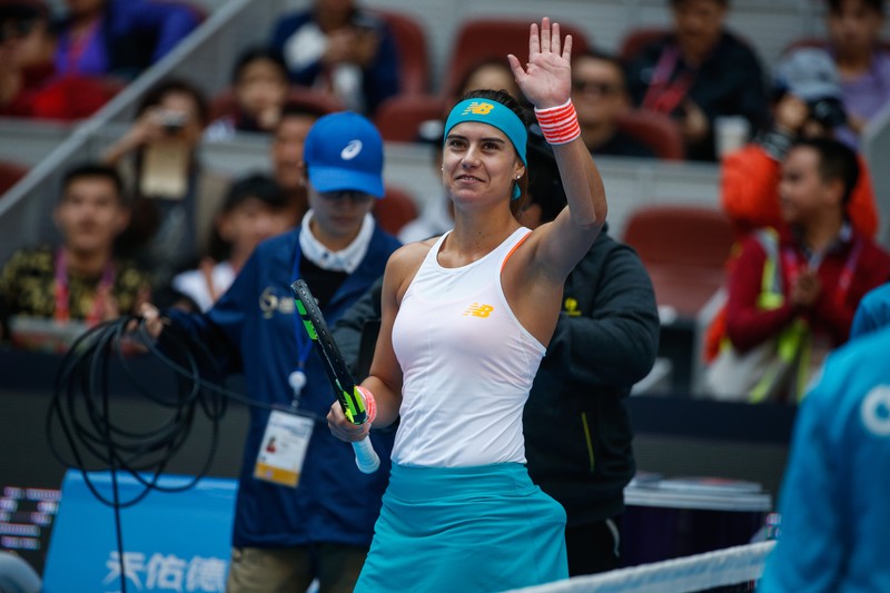 epa06245274 Sorana Cirstea of Romania waves after winning against Karolina Pliskova of the Czech Republic in their women's singles third round match of the China Open tennis tournament at the National Tennis Center in Beijing, China, 05 October 2017. EPA-EFE/ROMAN PILIPEY