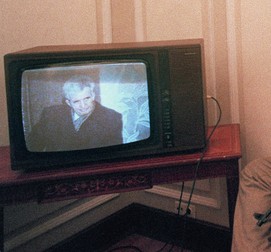 Anti-Communist soldiers watch 27 December 1989 in occupied headquarterers of the Central Committee of Romanian Communist party the trial of late Romanian President Nicolae Ceausescu as it was broadcast on Romanian TV. Ceausescu and his wife Elena were deposed and executed by a firing squad 25 December 1989. Eight years after the December 1989 revolution which toppled Ceausescu, Romania has begun lifting the veil on the "mysteries" surrounding the uprising and the circumstances which brought former president Ion Iliescu to power. According to general prosecutor Sorin Moisescu, reports put about at the time of "terrorists loyal to Ceausescu" provoking bloody diversions to sow panic in the population, were "fabricated" to justify Iliescu's takeover. "Nothing that happened after 22 December 1989 was due to chance. The deaths of some of the demonstrators were supposed to provide legitimacy to the new regime" Moisecu said 24 December 1998.,Image: 17446503, License: Rights-managed, Restrictions: , Model Release: no