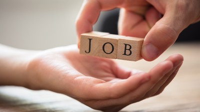 Close-up,Of,Businessperson's,Hand,Giving,Wooden,Block,With,Job,Text