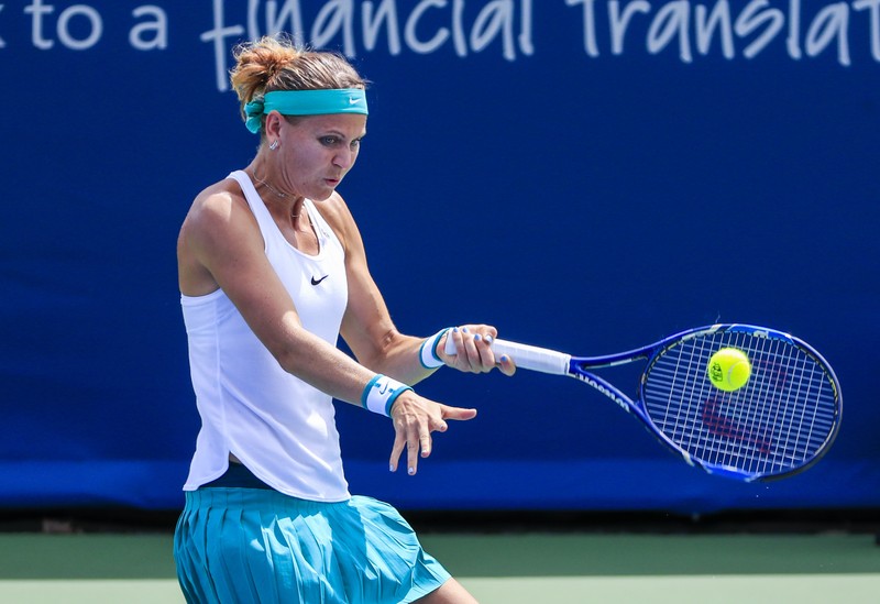epa05493977 Lucie Safarova of the Czech Republic hits a return shot to Andrea Petkovic of Germany in their first round match of the Western &amp; Southern Open tennis championships at the Linder Family Tennis Center in Mason, near Cincinnati, Ohio, USA, 17 August 2016. EPA/TANNEN MAURY