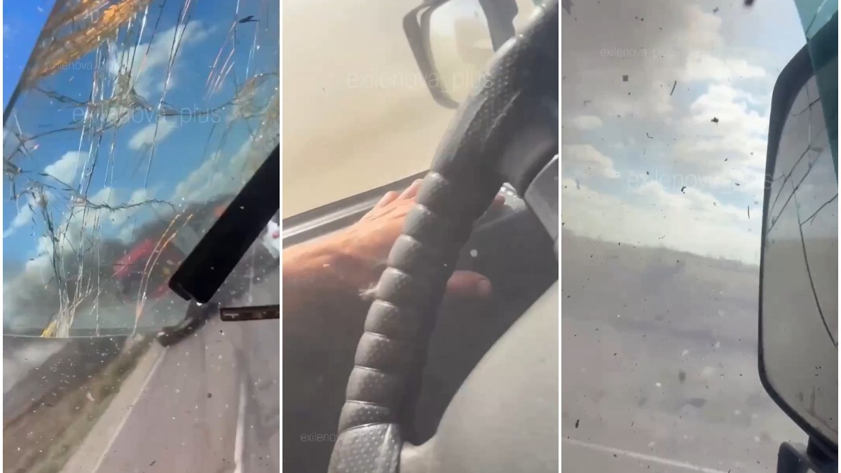 Colaj din trei cadre filmate din interiorul cabinei unui vehicul, surprinzând un parbriz spart, mâna șoferului pe volan și o oglindă retrovizoare laterală fisurată.