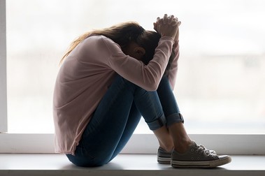 Depressed sad teen girl sit on sill crying alone at home, upset desperate young woman feeling frustrated anxious regret mistake suffer from unwanted teenage pregnancy abortion problem concept