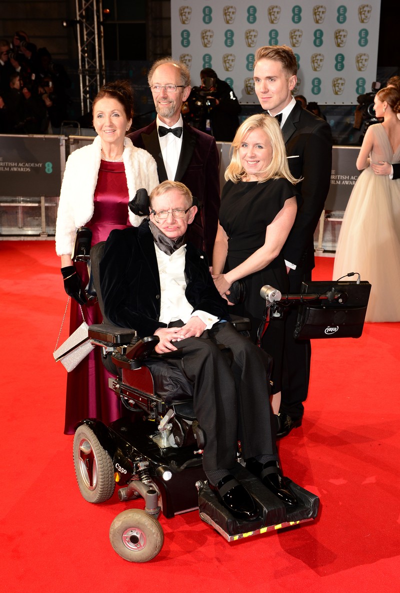 Stephen Hawking, Lucy Hawking (right) and Jane Wilde Hawking (left) attend the EE British Academy Film Awards at the Royal Opera House, Bow Street in London. PRESS ASSOCIATION Photo. Picture date: Sunday February 8, 2015. See PA story SHOWBIZ Bafta. Photo credit should read: Dominic Lipinski/PA Wire February 8, 2015 BAFTA