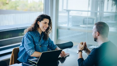 Smiling,Businesswoman,Taking,Interview,Of,A,Job,Applicant.,Friendly,Recruitment
