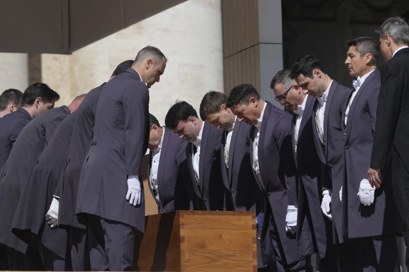 The coffin of Pope Francis is laid into St. Peter's Square during his funeral ceremony, at the Vatican, Saturday, April 26, 2025. (AP Photo/Alessandra Tarantino)