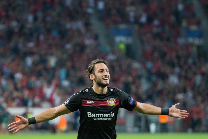 epa05539736 Leverkusen's Hakan Calhanoglu celebrates scoring the 2-0 lead during the UEFA Champions League group stage match Bayer Leverkusen vs CSKA Moscow in Leverkusen, Germany, 14 September 2016. EPA/ROLF VENNENBERND