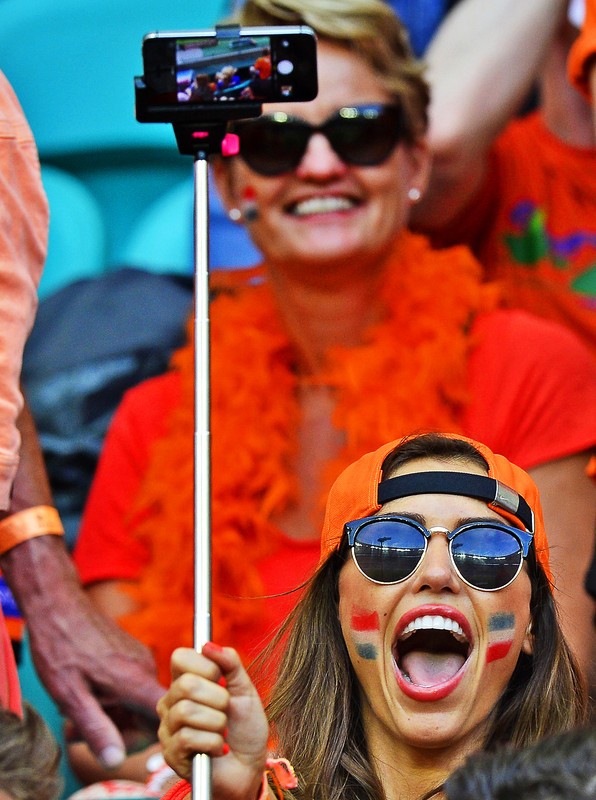 epa04255226 Yolanthe Sneijder, wife of Dutch national soccer player Wesley Sneijder, in the stands prior to the FIFA World Cup 2014 group B preliminary round match between Spain and the Netherlands at the Arena Fonte Nova in Salvador, Brazil, 13 June 2014. The Netherlands won 5-1. (RESTRICTIONS APPLY: Editorial Use Only, not used in association with any commercial entity - Images must not be used in any form of alert service or push service of any kind including via mobile alert services, downloads to mobile devices or MMS messaging - Images must appear as still images and must not emulate match action video footage - No alteration is made to, and no text or image is superimposed over, any published image which: (a) intentionally obscures or removes a sponsor identification image; or (b) adds or overlays the commercial identification of any third party which is not officially associated with the FIFA World Cup) EPA/KOEN VAN WEEL EDITORIAL USE ONLY