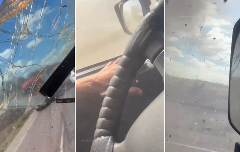 Colaj din trei cadre filmate din interiorul cabinei unui vehicul, surprinzând un parbriz spart, mâna șoferului pe volan și o oglindă retrovizoare laterală fisurată.
