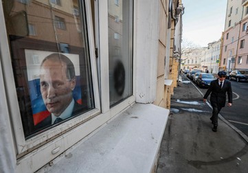 Portretul lui Putin e omniprezent pe străzile capitalei ruse | Foto: EPA