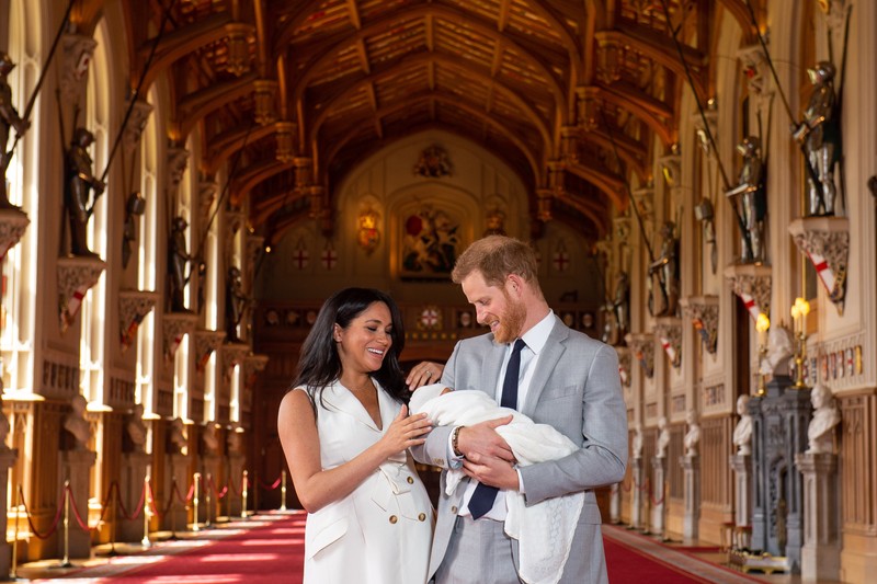 EMBARGOED to 1240 WEDNESDAY MAY 08 2019. The Duke and Duchess of Sussex with their baby son, who was born on Monday morning, during a photocall in St George's Hall at Windsor Castle in Berkshire. May 8, 2019