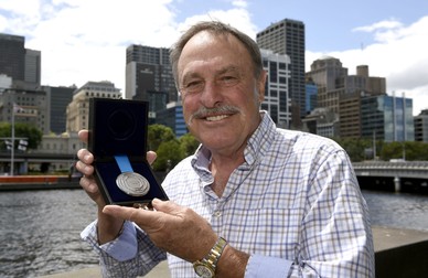 epa05039346 A picture made available on 24 November 2015 shows former Australian Tennis champion John Newcombe holding the John Newcombe medal in Melbourne, Australia, 23 November 2015. The Newcombe Medal is awarded annually to Australia's most outstanding elite tennis player and ambassador for the sport. EPA/MAL FAIRCLOUGH AUSTRALIA AND NEW ZEALAND OUT