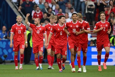 STUTTGART, GERMANY - JUNE 16: Christian Eriksen (10) of Denmark celebrates scoring his team's first goal with teammate Victor Kristiansen during the UEFA EURO 2024 group stage match between Slovenia and Denmark at Stuttgart Arena on June 16, 2024 in Stuttgart, Germany. Gokhan Balci / Anadolu/ABACAPRESS.COM